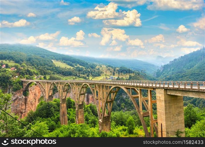 Clouds over Djurdjevica bridge in mountains of Montenegro