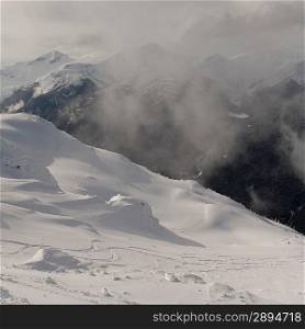 Clouds over snow covered mountains, Whistler, British Columbia, Canada
