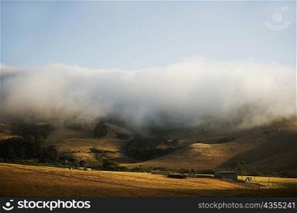 Clouds rolling over a hill range