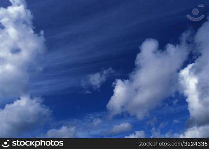 Clouds Streaking Through A Blue Sky