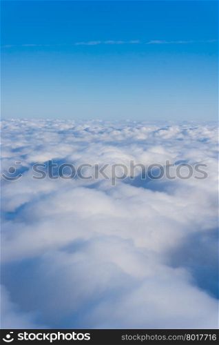 Clouds. view from the window of an airplane. cloudscape scenery with blue sky above