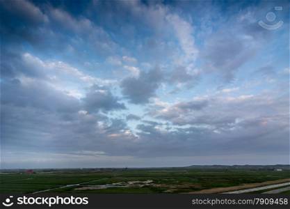 cloudscape above a dutch landscape