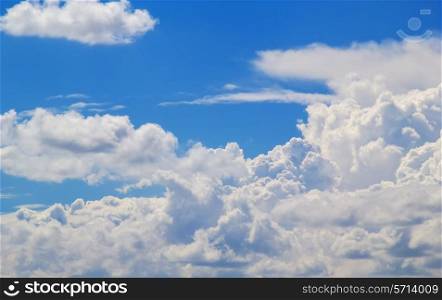 Cloudscape in sunlight with blue sky in the background.