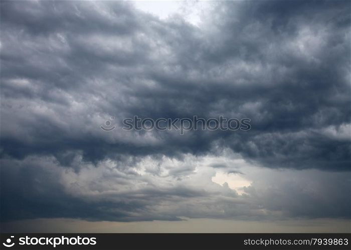 cloudscape with dark rainy clouds in the evening spring sky