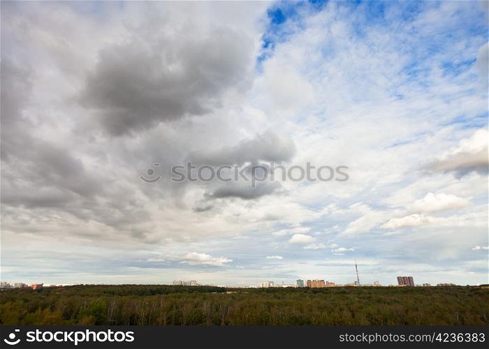 cloudscape with grey autumn clouds under city afternoon