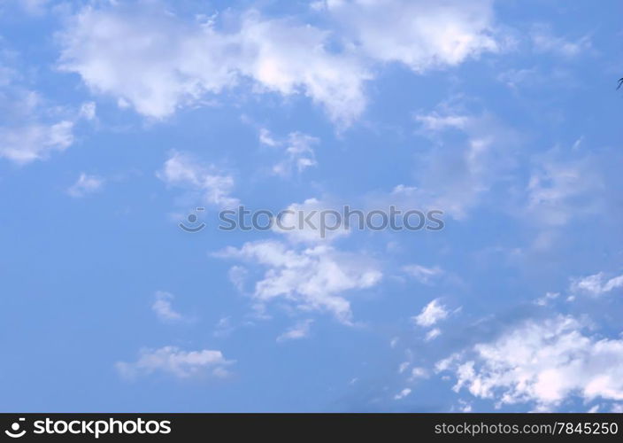 cloudscape with white fluffy clouds in the blue sky . blue sky
