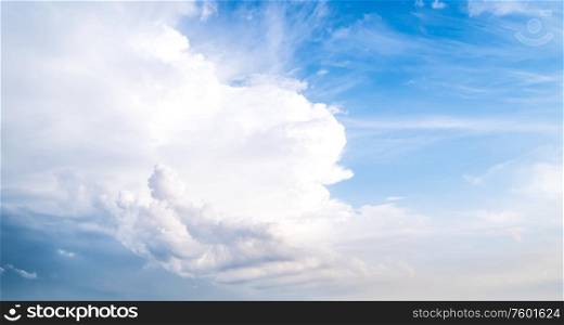 Cloudy blue sky. Summer day background. Cloudy blue sky