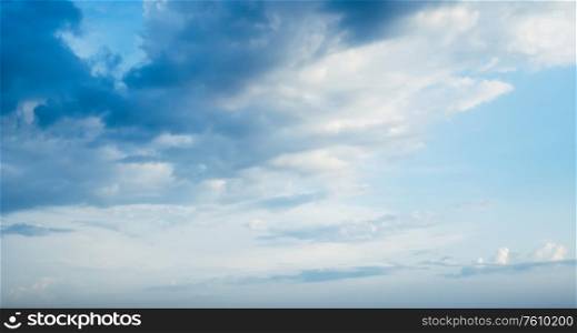 Cloudy blue sky. Summer day background. Cloudy blue sky