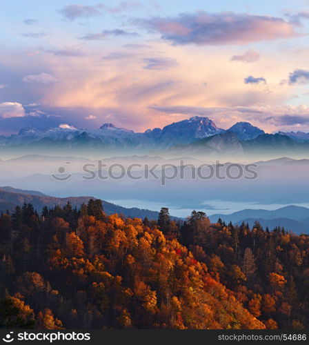 Cloudy colorfull sunrise at Alpine high mountains