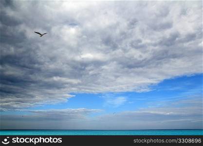 Cloudy dramatic sky in caribbean turquoise sea ocean