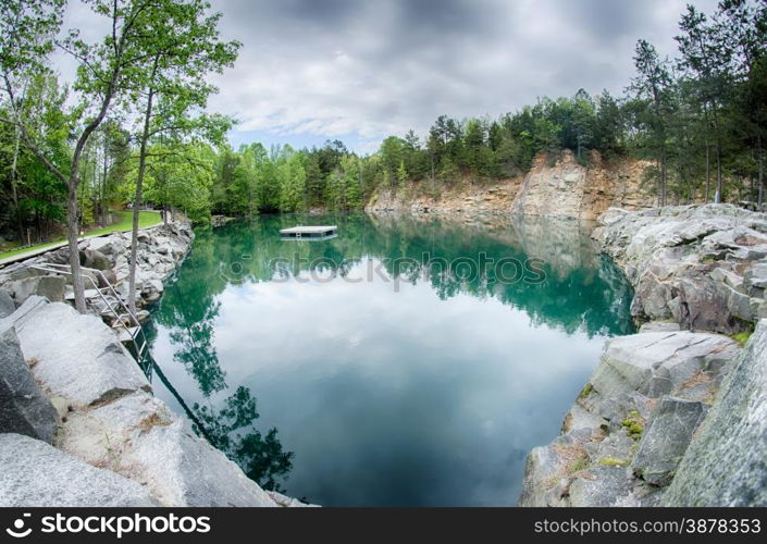 cloudy skies and reflections at a quarry