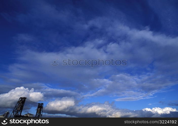 Cloudy Sky Above An Industrial Bridge