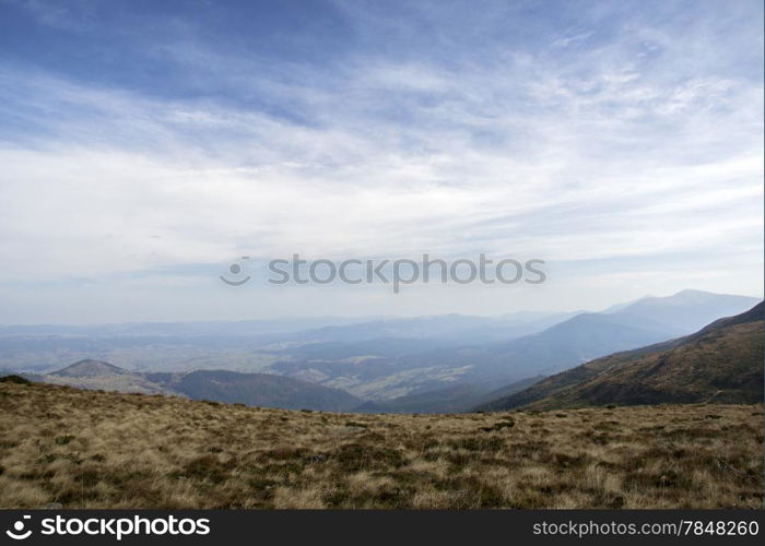 cloudy sky over a large mountain plateau