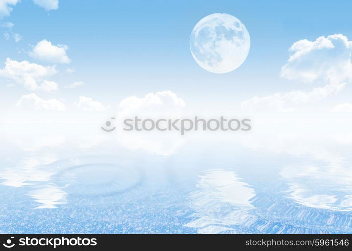 Cloudy sky with moon and tranquil sea