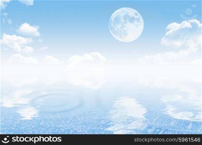 Cloudy sky with moon and tranquil sea