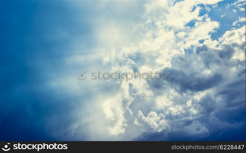 Cloudy sky with sun rays, nature background