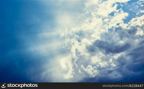 Cloudy sky with sun rays, nature background