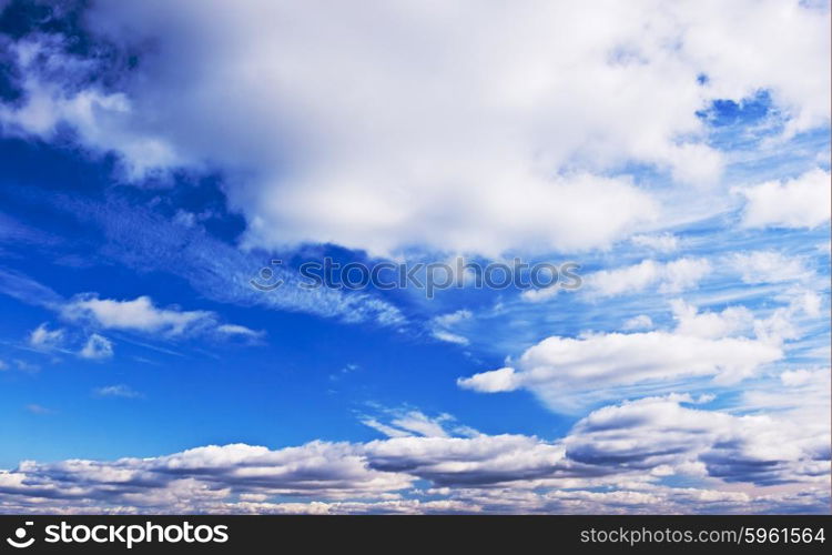 Cloudy summer midday blue sky