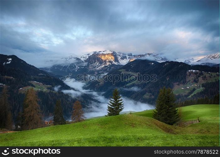 Cloudy sunrise over Dolomite mountains. Italian Dolomites