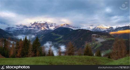 Cloudy sunrise over Dolomites mountains. Italian Dolomites