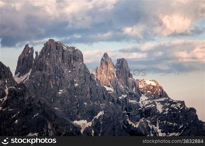 Cloudy sunset at Passo Rolle, Dolomites Alps, Italy