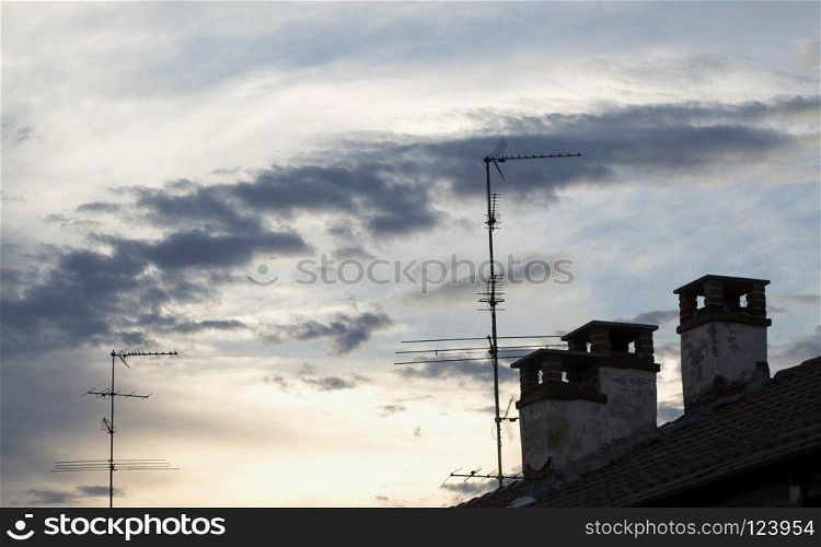 Cloudy sunset on the rooftops, horizontal image