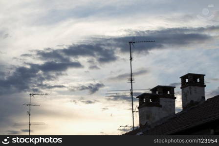 Cloudy sunset on the rooftops, horizontal image