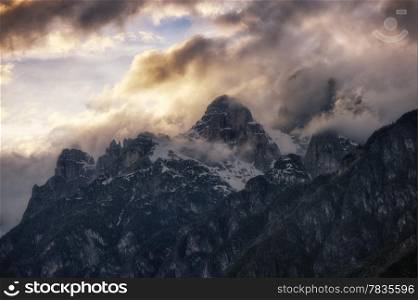 Cloudy sunset over Dolomites mountains. Italian Dolomites