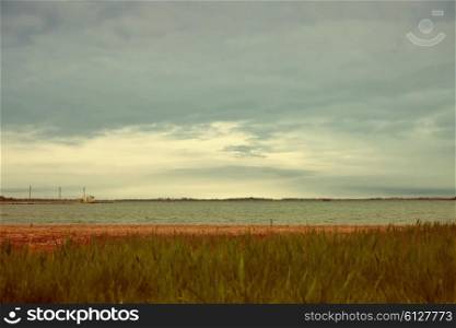 Cloudy weather Landscape with Coast of lake and sky