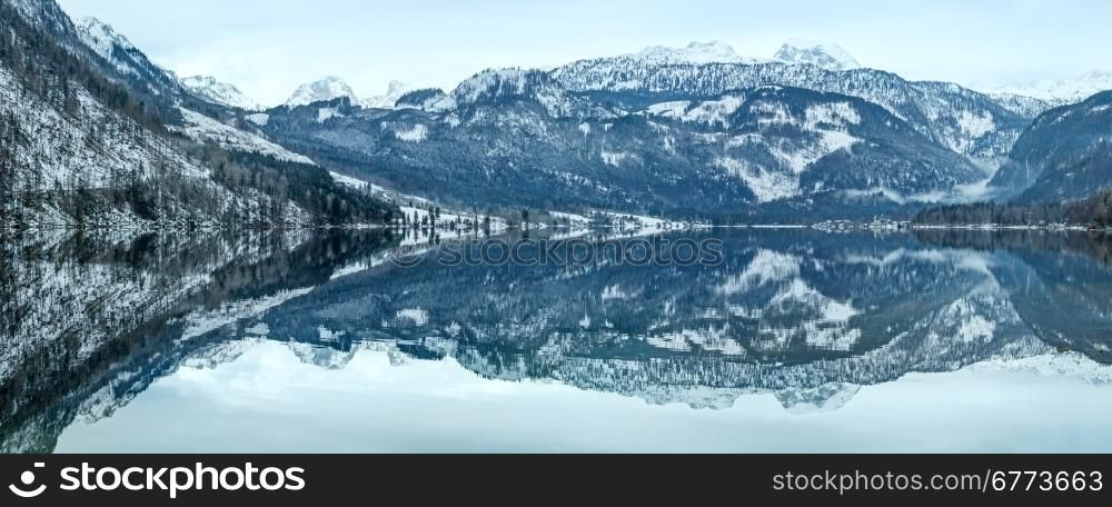 Cloudy winter Alpine lake Grundlsee view (Austria) with fantastic pattern-reflection on the water surface.