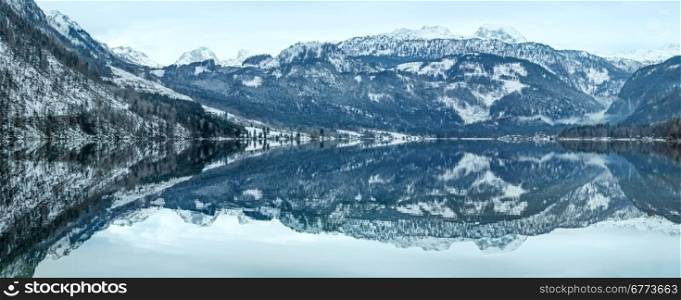 Cloudy winter Alpine lake Grundlsee view (Austria) with fantastic pattern-reflection on the water surface.