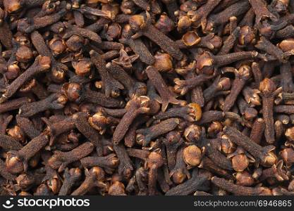 Cloves background. Dried spice texture. Top view