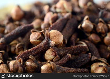 Cloves  spice  in bamboo basket isolated on white background