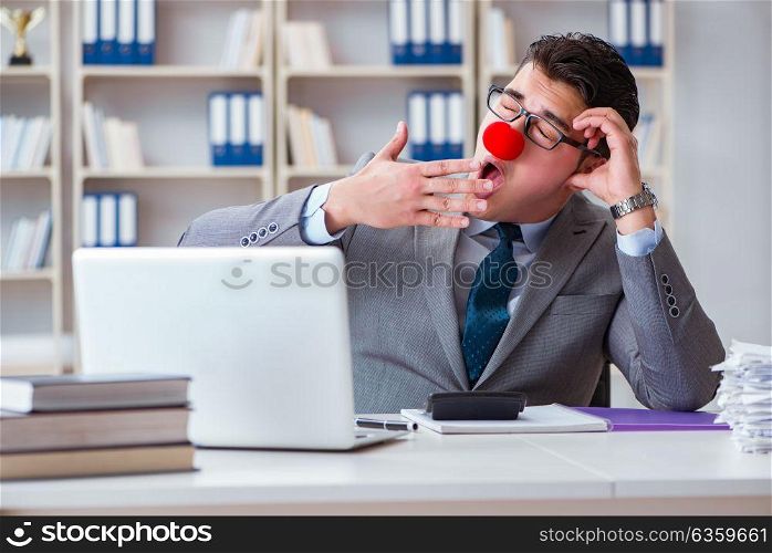 Clown businessman tired sleepy in the office