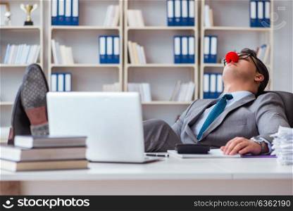 Clown businessman tired sleepy in the office