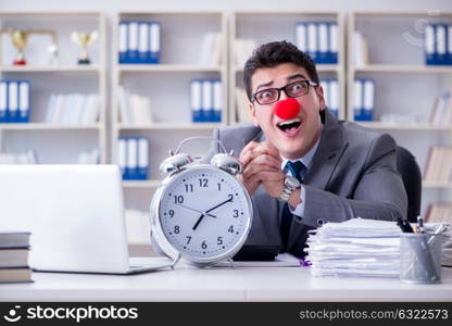 Clown businessman with alarm clock missing dieadline