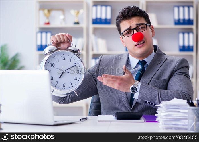 Clown businessman with alarm clock missing dieadline