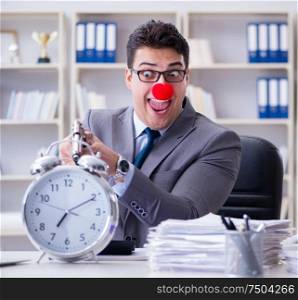 Clown businessman working in the office angry frustrated with a gun. Clown businessman working in the office angry frustrated with a
