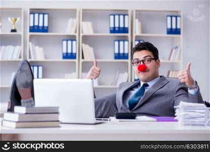 Clown businessman working in the office. Clown businessman working in the office