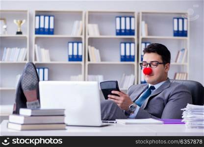 Clown businessman working in the office. Clown businessman working in the office