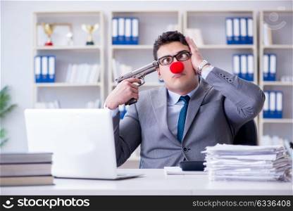 Clown businessman working in the office frustrated committing su. Clown businessman working in the office frustrated commiting suicide