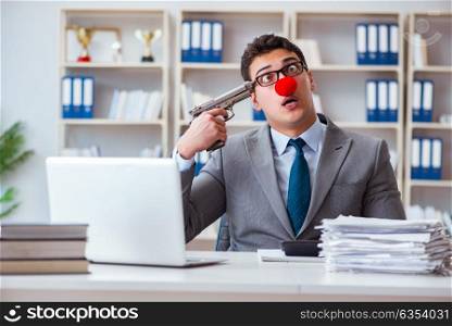 Clown businessman working in the office frustrated committing su. Clown businessman working in the office frustrated commiting suicide