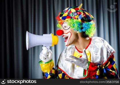 Clown in studio with loudspeaker