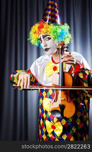 Clown playing on the violin