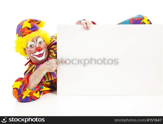 Clown reclines while pointing to a blank sign. Design element on white background.
