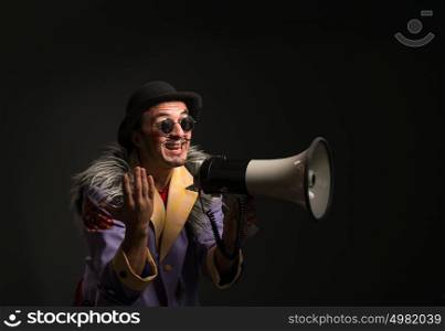 Clown shouting at the megaphone