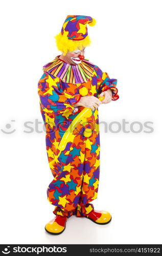 Clown twisting a balloon into the shape of an animal. Full body isolated.