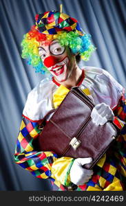 Clown with business briefcase