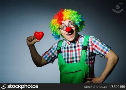 Clown with red heart in romantic concept