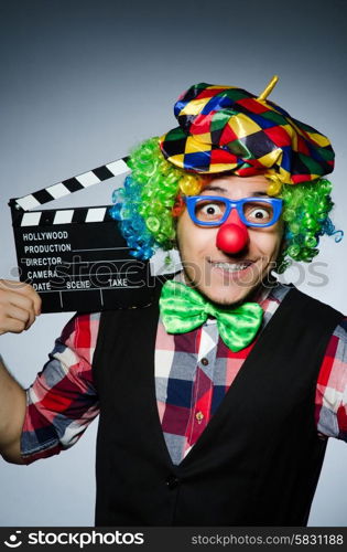 Clown with the movie board